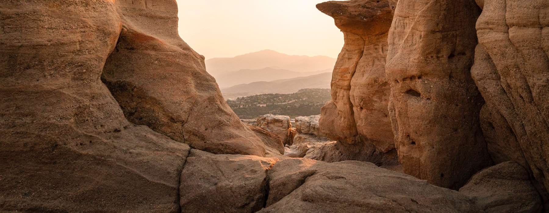 rock formation frames mountain view